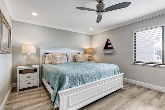 bedroom featuring crown molding, ceiling fan, and light wood-type flooring