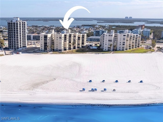 bird's eye view featuring a beach view and a water view