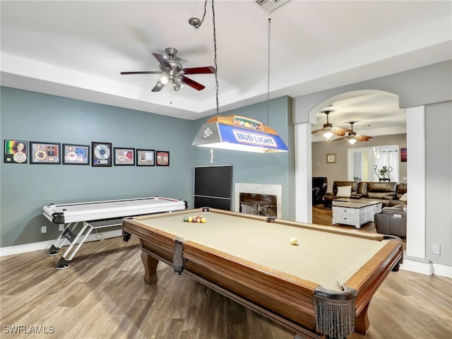 playroom featuring wood-type flooring, ceiling fan, and pool table