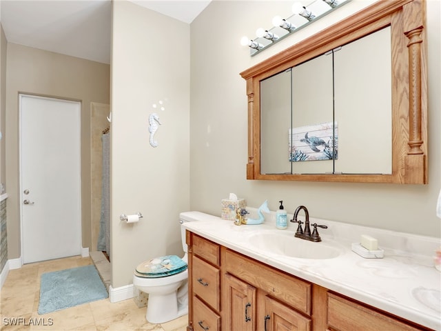 bathroom with a shower, tile patterned flooring, vanity, and toilet