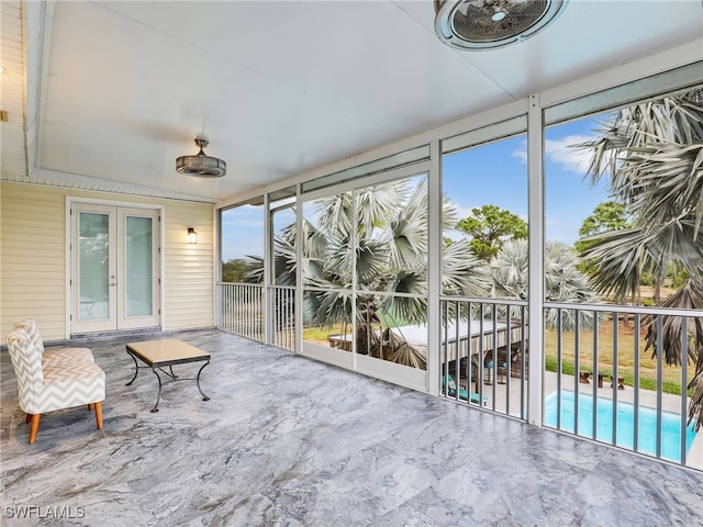 sunroom / solarium featuring a healthy amount of sunlight