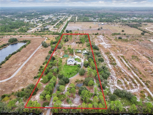 drone / aerial view featuring a rural view and a water view