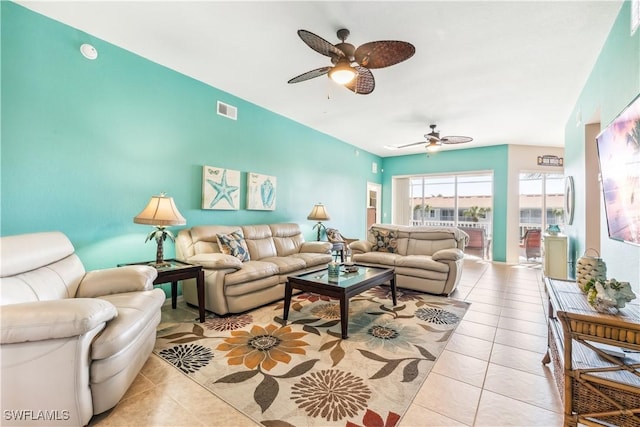 living room featuring light tile patterned floors and ceiling fan