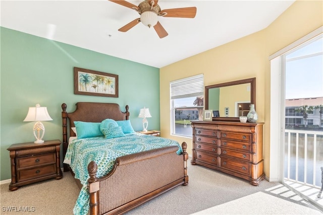 bedroom with a ceiling fan, light carpet, and baseboards