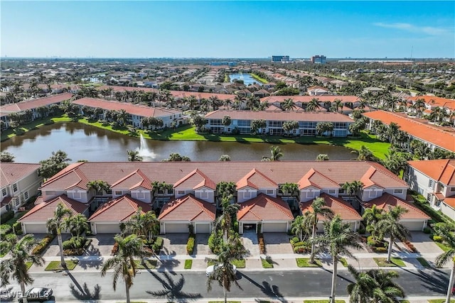 bird's eye view featuring a water view and a residential view