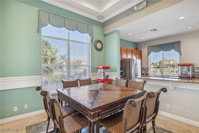 dining space featuring wainscoting, visible vents, and recessed lighting