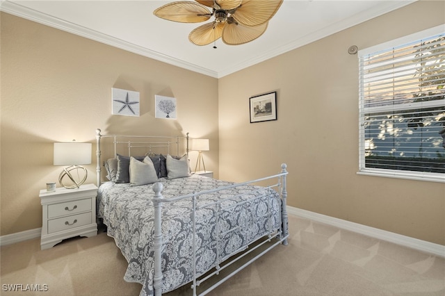 bedroom featuring ceiling fan, crown molding, and light carpet