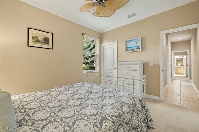 carpeted bedroom with ceiling fan and crown molding