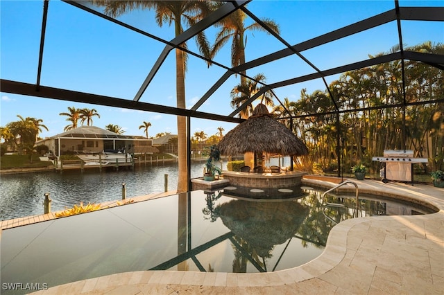 view of swimming pool featuring area for grilling, a gazebo, a water view, glass enclosure, and a patio area