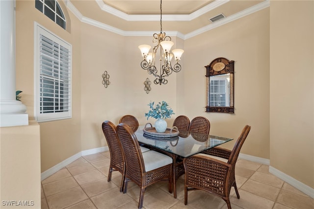 dining space featuring light tile patterned flooring, a notable chandelier, and ornamental molding