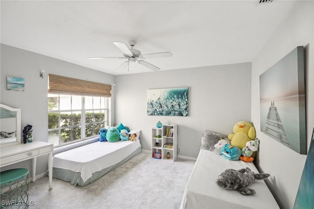 bedroom with light colored carpet and ceiling fan