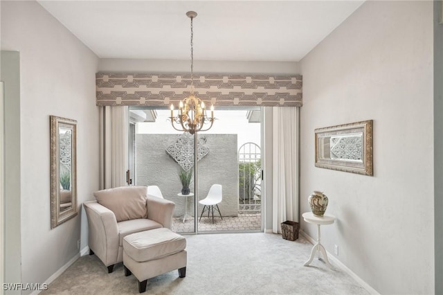 living area with carpet and an inviting chandelier