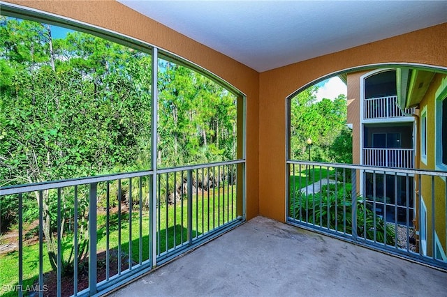 unfurnished sunroom with plenty of natural light