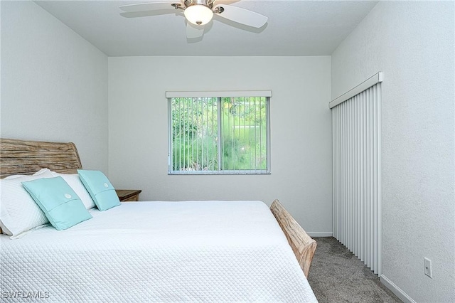 bedroom featuring ceiling fan and carpet