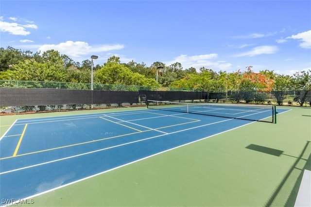 view of sport court featuring basketball hoop