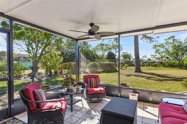 sunroom featuring ceiling fan