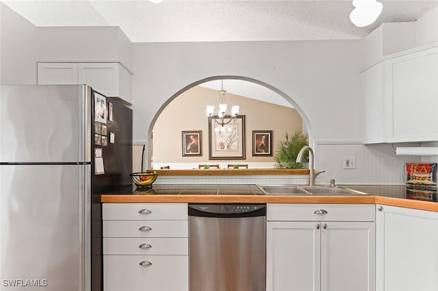 kitchen featuring white cabinets, sink, and appliances with stainless steel finishes