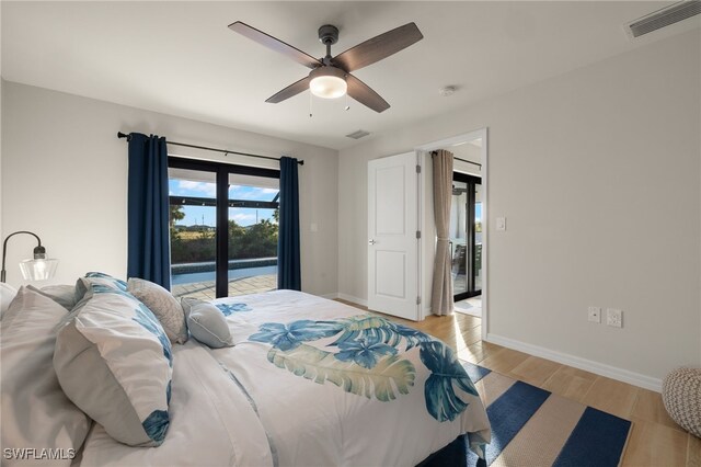 bedroom featuring access to outside, ceiling fan, and light wood-type flooring