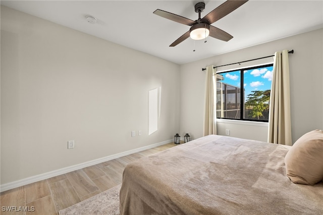 bedroom featuring ceiling fan and light wood-type flooring