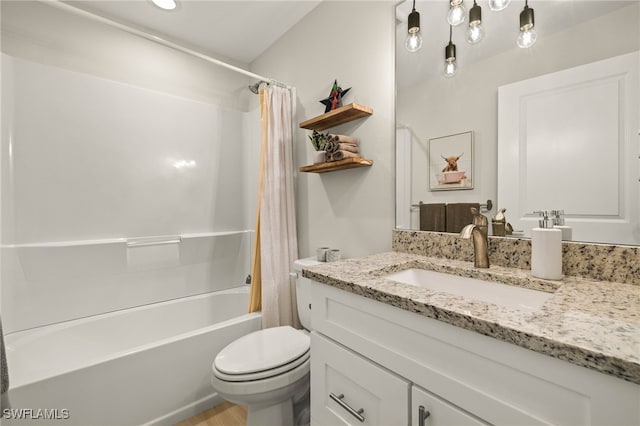 full bathroom featuring shower / tub combo with curtain, vanity, and toilet