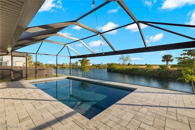 view of pool featuring a water view, a patio area, and a lanai