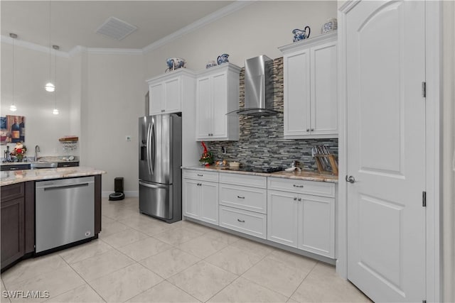 kitchen featuring stainless steel appliances, white cabinetry, wall chimney exhaust hood, and crown molding