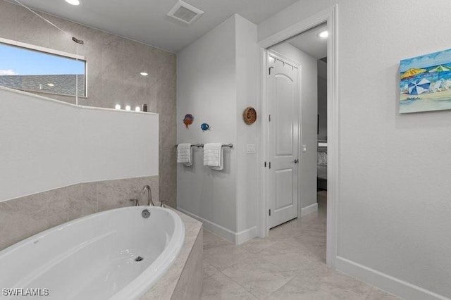 bathroom featuring tiled bath