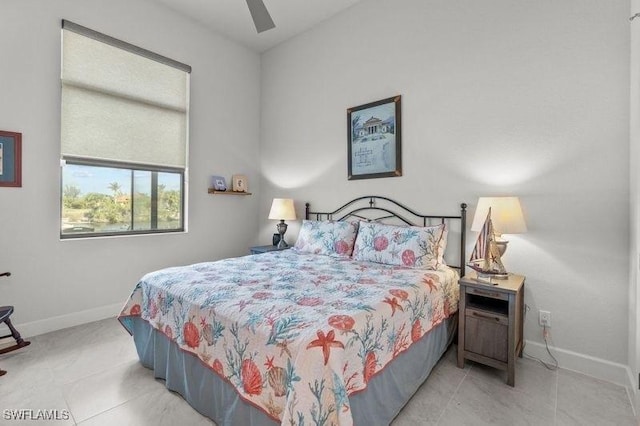 tiled bedroom with ceiling fan