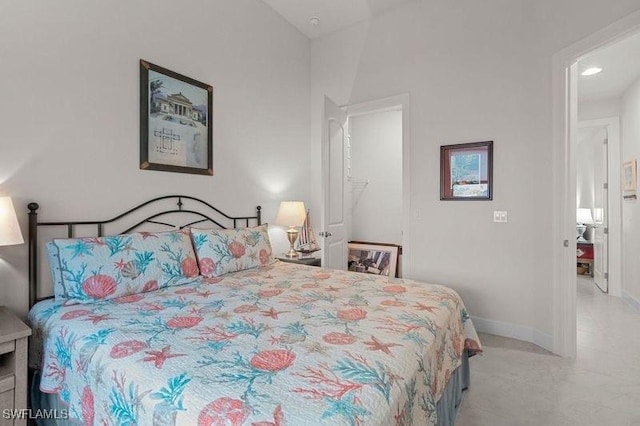 bedroom featuring vaulted ceiling