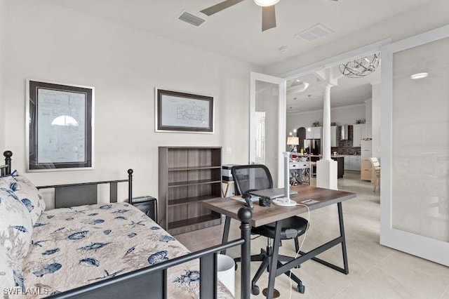 bedroom featuring ceiling fan and ornate columns