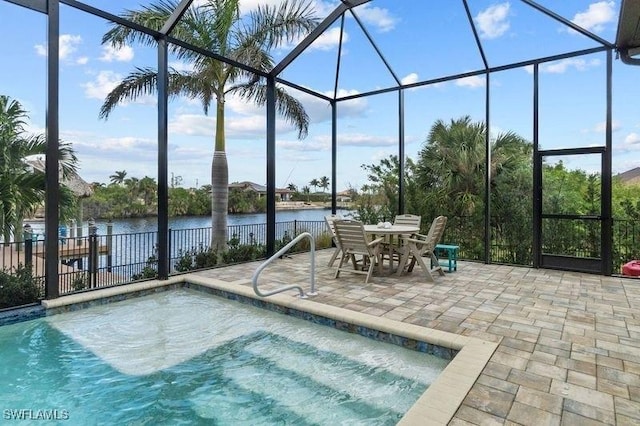 view of pool featuring a lanai, a water view, and a patio