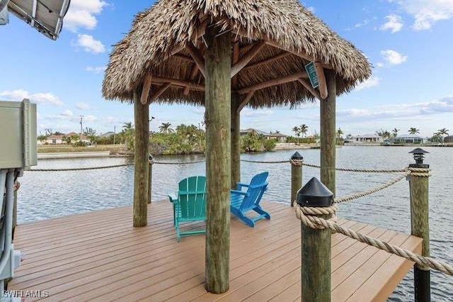 dock area with a gazebo and a water view