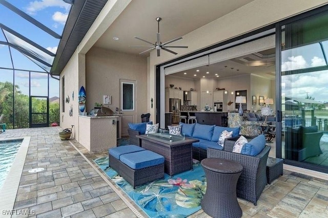 view of patio / terrace with outdoor lounge area, area for grilling, ceiling fan, and a lanai