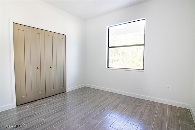 unfurnished bedroom featuring a closet