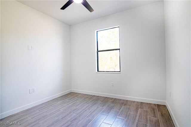 unfurnished room featuring light hardwood / wood-style flooring and ceiling fan