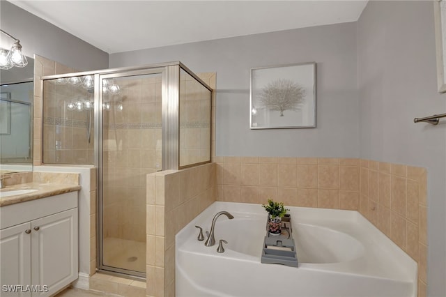 bathroom with plus walk in shower, vanity, and tile patterned floors