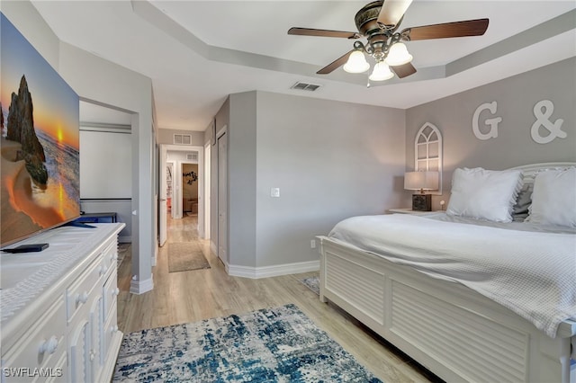 bedroom featuring light hardwood / wood-style flooring and ceiling fan