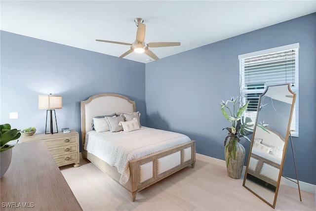 bedroom featuring ceiling fan and light hardwood / wood-style flooring