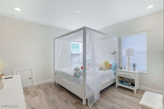 bedroom with light hardwood / wood-style flooring