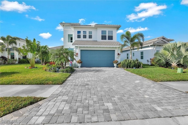 view of front facade featuring a garage and a front yard