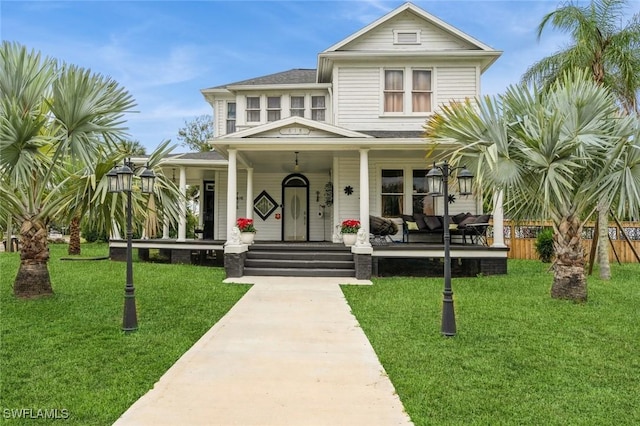 view of front facade with a porch and a front yard