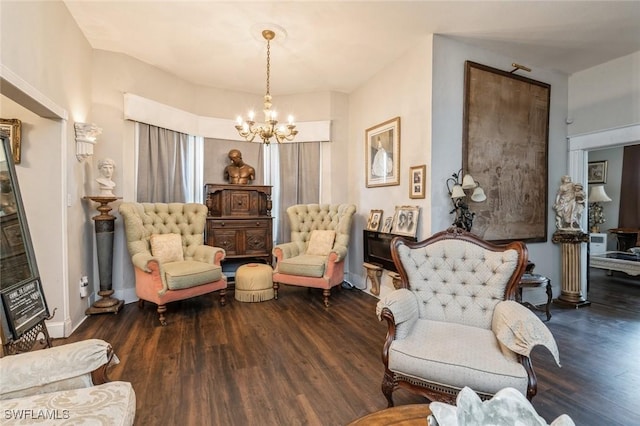 living area featuring a chandelier and dark hardwood / wood-style flooring