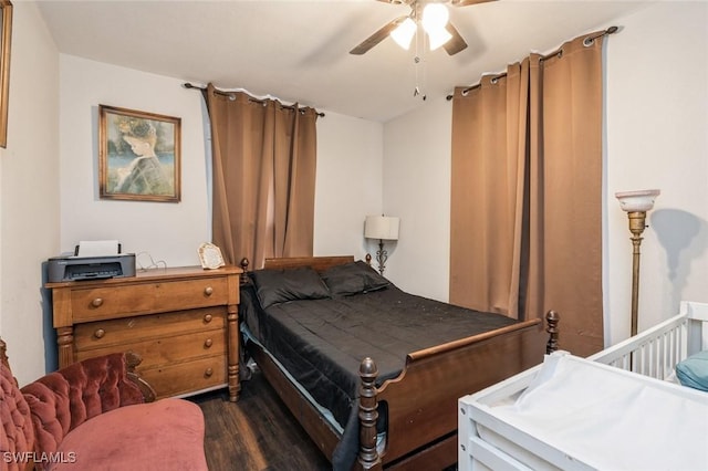 bedroom with ceiling fan and dark hardwood / wood-style flooring