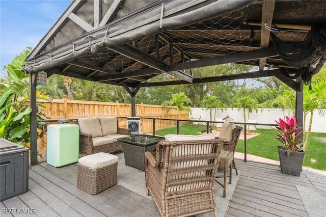 wooden terrace with an outdoor living space