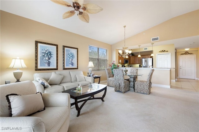 living room with light carpet, ceiling fan with notable chandelier, and vaulted ceiling