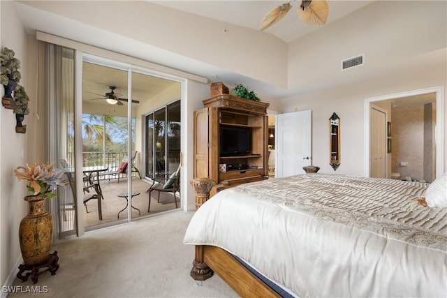 carpeted bedroom featuring access to exterior, ceiling fan, and a towering ceiling