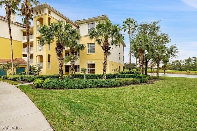 view of building exterior with a water view