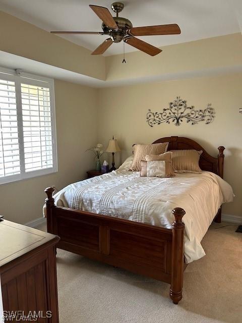 bedroom featuring ceiling fan and light colored carpet