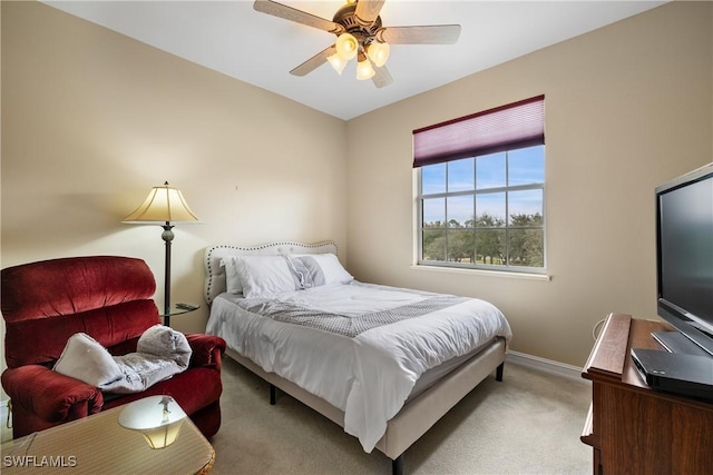 bedroom with light carpet and ceiling fan