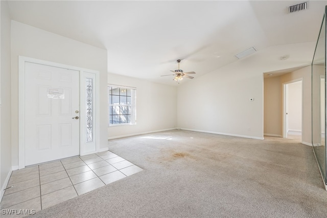 entrance foyer featuring ceiling fan, light colored carpet, and lofted ceiling